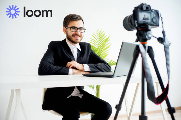 Man videotaping him at desk with Loom logo