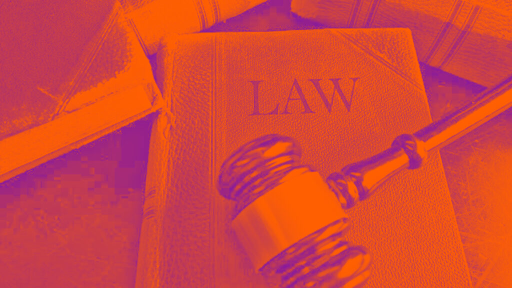 A gavel on top of a law book.