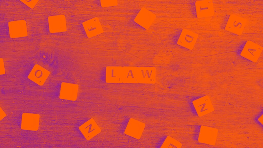 Scrabble tiles with the word LAW