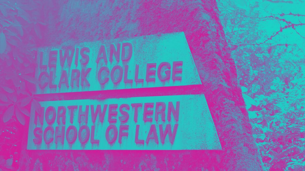 Lewis and Clark College Northwestern School of Law signage on mossy concrete.