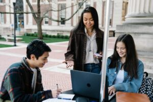 A group of LSAT students collaborating and discussing test strategies in a study group