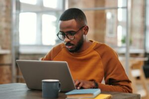 Student in front of his laptop