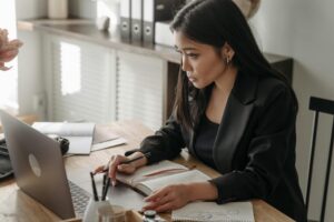 Student practicing LSAT online using laptop 