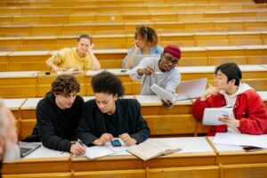 Young adults working together on LSAT prep as first-generation college students.